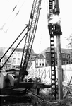 1974.G1b Heien van de 1e paal voor de nieuwbouw van Stroucken op het Munsterplein op 15-10-1974