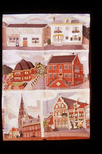 0602 Naaldkunst van Gerda v.d. Mosselaar waarmee zij zes gebouwen heeft vereeuwigd. Zoals op de bovenste rij de panden ...