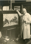 1089-051 W.L Bouwmeester in zijn atelier bij een schilderij van stoomtreinen