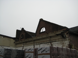 13 vervallen gebouw van textielfabriek aan de Hofstraat achter hek, 18-11-2008