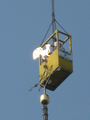 1992 terugplaatsen van de vergulde haan op de torenspits door gedeputeerde mw. Traag, 23-05-2012
